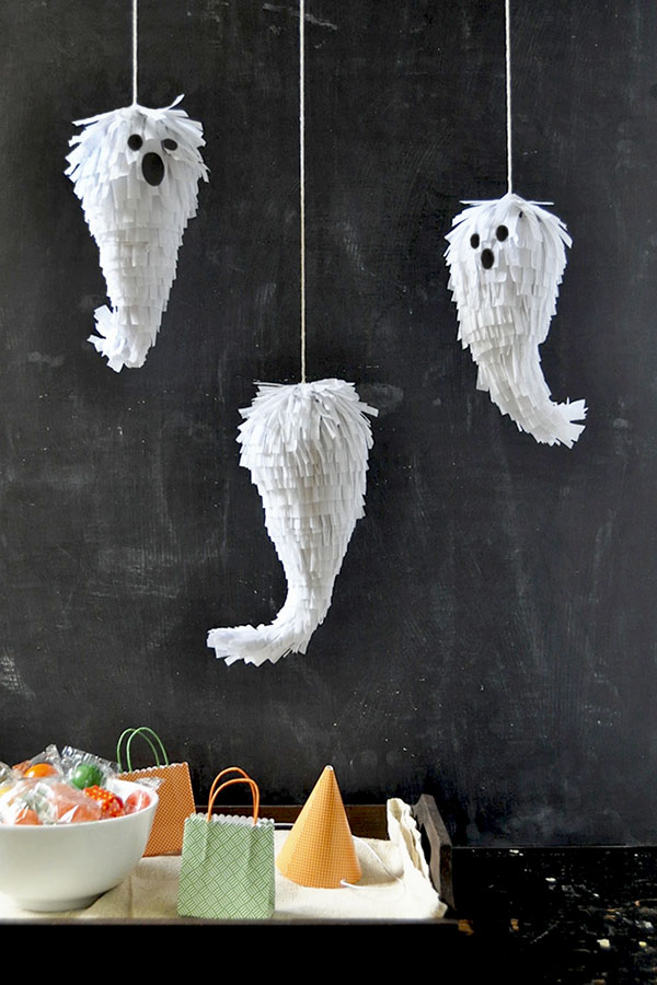 Halloween handmade decor. How to make funny paper bat. Cutting the shape  with scissors. Step 2. Top view, flat lay Stock Photo